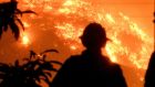 Firefighters watch the Thomas wildfire in the hills outside Montecito, California, on Saturday. Photograph: Reuters  
