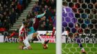 Stoke City’s Erik Pieters fouls West Ham United’s Manuel Lanzini and referee Graham Scott consequently awards a penalty. Photo: Andrew Yates/Reuters