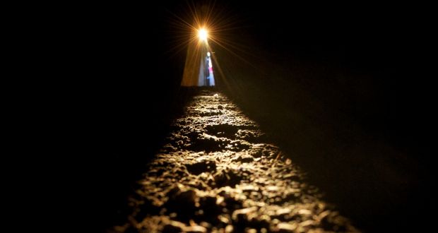 The sun shines along the passage floor into the inner chamber at newgrange during the 2013 Winter Solstice at Newgrange. Photograph: Alan Betson