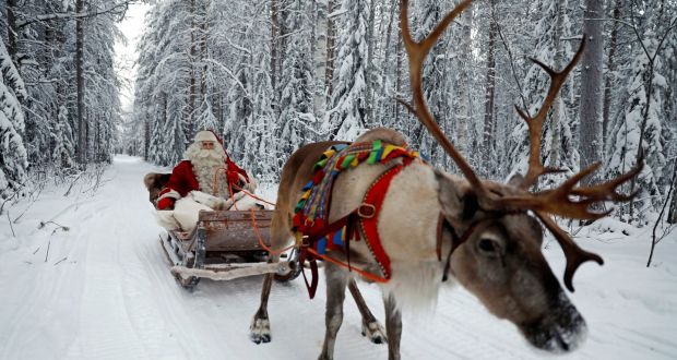 More efficient delivery than Amazon -  Santa Claus in his sleigh  in the Arctic Circle. Photograph: Reuters/Pawel Kopczynski 