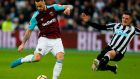 West Ham’s  Marko Arnautovic scores the opening goal despite a challenge from Newcastle United’s  Ciaran Clark during the Premier League game at   The London Stadium. Photograph: Ian Kington/AFP/Getty Images