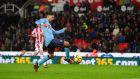 Ayoze Perez strikes late for Newcastle against Stoke. Photograph: Stu Forster/Getty