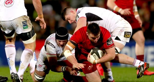 Ulster’s Kieran Treadwell and Nick Timoney tackle Niall Scannell on New Year’s Day. Photograph: James Crombie/Inpho