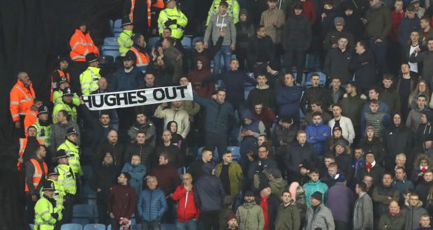 A “Hughes out” banner is held by Stoke fans at the Ricoh Arena in Coventry. Photograph: Matthew Lewis/Getty Images