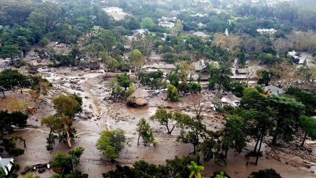 An aerial view taken aboard Santa Barbara County Air Support Unit’s Fire Copter 308 of mudflow and damage following heavy rains in Montecito. Photograph: Santa Barbara County Fire Dept/Matt Udkow/EPA