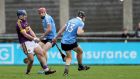 Wexford’s Kevin Foley breaks his hurley in a challenge by  Cian McBride and Donal Burke of Dublin during the Bord na Mona Walsh Cup semi-final at Parnell Park. Photograph: Oisin Keniry/Inpho