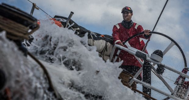 Alex Gough on the wheel surfing the waves on board Sun Hung Kai/Scallywag during the leg from Melbourne to Hong Kong. Photograph:  Konrad Frost/Volvo Ocean Race
