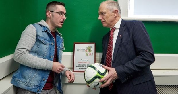 Sligo Rovers marketing and PR officer Shane Crossan (left) talks with Minister of State for Equality, Immigration and Integration David Stanton at a ceremony at Carmichael House in Dublin. Photograph: Barry Cronin 