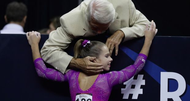 Ragan Smith is congratulated by Bela Karolyi during the  2016 US  Olympic Trials. Photograph:  Ezra Shaw/Getty Images