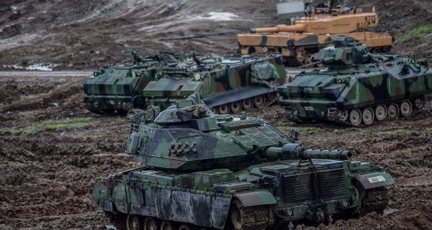 Turkish army tanks  at  the Syrian border at Hassa: Germany exported €25.1 billion in arms last year, making it the  third-largest arms dealer. Photograph: Ozan Kose/AFP/Getty 
