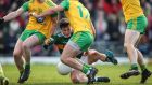  Kerry’s Paul Murphy under pressure from Ciaran Thompson, Hugh McFadden and Paul Brennan of Donegal. Photograph: Cathal Noonan/Inpho