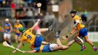 Clare’s Tony Kelly and Padraic Maher of Tipperary take a tumble in Ennis. Photograph: James Crombie/Inpho
