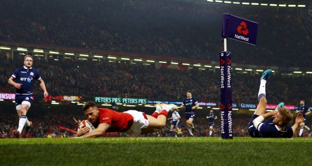 Gareth Davies dives over for the first Welsh try against Scotland. Photograph:  Michael Steele/Getty Images