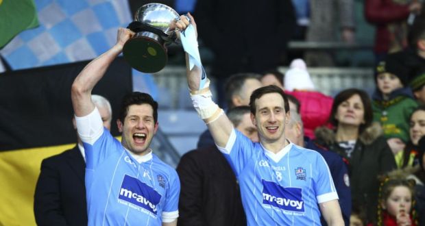 Sean Cavanagh and Colm Cavanagh raise the All-Ireland intermediate trophy. Photograph: Ken Sutton/Inpho