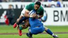 Ireland’s Bundee Aki is tackled by France’s Matthieu Jalibert  of France  in the Six Nations round one match on Saturday. Jalibert partially ruptured a knee ligament in the tackle. Photograph: James Crombie/Inpho
