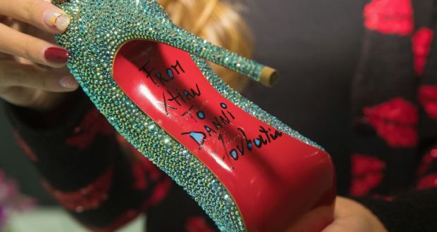 Can Christian Louboutin trademark soles?
