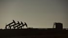 Four pumpjacks  at the site of an oil well in North Dakota, US. Photograph: Daniel Acker/Bloomberg