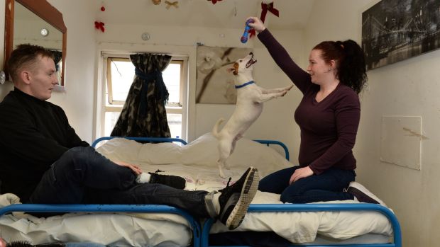 Mary and Paulie with their dog Scooter, at their accommodation, in Dublin. Photograph: Dara Mac Donaill/The Irish Times