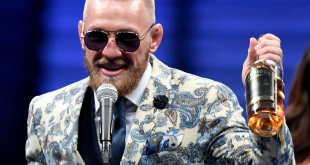Conor McGregor speaks to the media while holding up his Notorious’ brand of whiskey after losing to Floyd Mayweather Jr  in their super welterweight bout in Las Vegas, Nevada, last August. Photograph: Ethan Miller/Getty Images