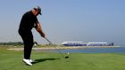 Darren Clarke tees off on the par four 18th hole during the second round of the NBO Oman Open at Al Mouj Golf. Photograph: Andrew Redington/Getty Images