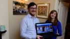 Michael Doyle and Rosanna Kleemann with their laptop which they  used to find their new home. Photograph: Cyril Byrne 