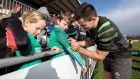 Jacob Stockdale signs autographs for fans at an open Irish training session. Photograph: Billy Stickland/Inpho