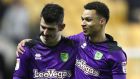Norwich City goalscorer  Nelson Oliveira (left) gets a hug from Josh Murphy at the end of the  Championship match against Wolves at Molineux. Photograph:   Nick Potts/PA Wire