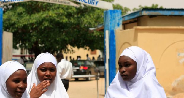 Young women stand in front of a school in Maiduguri, Nigeria in 2013. At least 13 students may still be missing after the attack by Boko Haram on the village of Dapchi, northeastern Nigeria. Photograph:  Jon Gambrell/AP