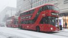  A London bus travels through the snow in Oxford Street in central London, Britain. Photograph: Facundo Arrizabalaga/EPA