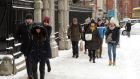 Walking in the snow in Dublin city centre on Thursday. Many theatres, cinemas and museums have cancelled events. Photograph: Dara Mac Dónaill/The Irish Times