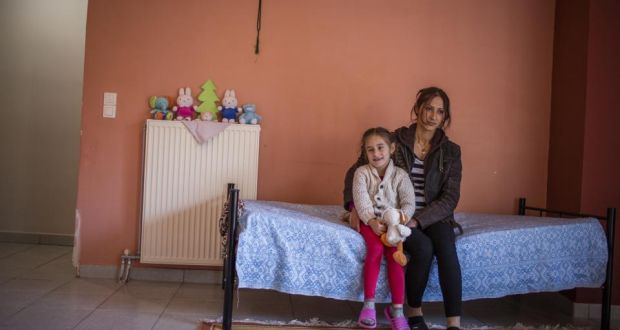 Zaineb, from Aleppo in Syria, with one of her three children at an apartment funded by the EU, in Livadia. Photograph: DG Echo