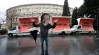 An activist wearing a mask of Forza Italia party leader Silvio Berlusconi poses during a tour, the day after Italy’s parliamentary elections, in Rome. Photograph: Max Rossi/Reuters