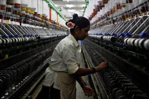 A woman works at a textile mill in Mumbai, India.   Photograph: Francis Mascarenhas /Reuters
