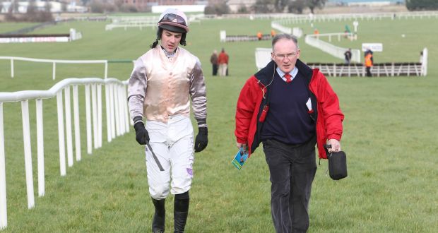  Adrian McGoldrick walking back with with jockey Brian O’Connell after a fall 
