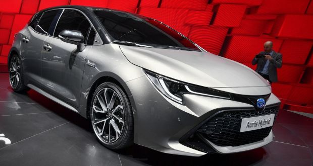 The new Toyota Auris hybrid model car, is seen at the stand of Japanese carmaker during the Geneva International Motor Show last week. Photograph:  Fabrice Coffrini/AFP/Getty Images