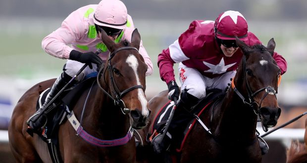 Apple’s Jade ridden by Bryan Cooper (right) beats Vroom Vroom Mag ridden by Paul Townend to win the OLBG Mares Hurdle at Cheltenham last year. Photograph: Dan Sheridan/Inpho 