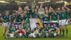 The Ireland team celebrate winning the Grand Slam at the Millennium Stadium in Cardiff. Photograph: Morgan Treacy/Inpho