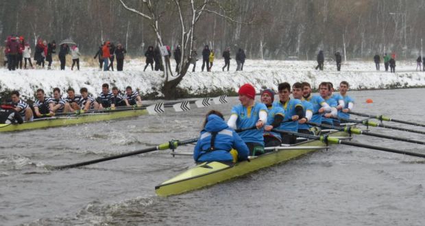 Gannon Cup: Trinity’s eight (left) overtake UCD in a thrilling race on the Liffey. Photograph: Liam Gorman