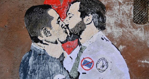 A mural in Rome depicting Five Star Movement leader Luigi Di Maio  kissing League leader Matteo Salvini in the context of their striking a deal. Photograph: Tiziana Fabi/AFP/Getty Images