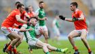 Fermanagh’s Barry Mulrone is tackled by Brendan Donaghy of Armagh during the Allianz Football League Division Three final at  Croke Park. Photograph: Laszlo Geczo/Inpho