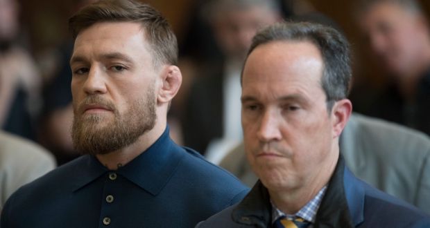 Conor McGregor stands with his lawyer Jim Walden during his arraignment in Brooklyn Criminal Court on Friday. Photograph: AP