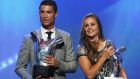 Ronaldo and Netherlands midfielder Lieke Martens with their respective ‘Best Player in Europe’ awards in Monaco. Photograph: Valery Hache/AFP/Getty 