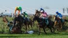 Saint Are (top) ridden by AP Husking falls over Alpha Des Obeaux ridden by Rachael Blackmore at the Chair fence during the Random Health Grand National at Aintree. Photograph: Peter Powell/EPA 