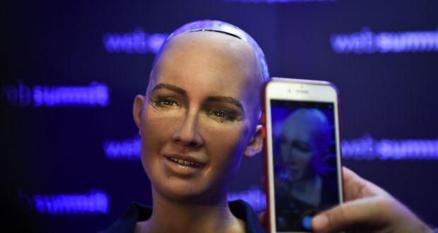 A woman takes pictures of Humanoid “Sophia The Robot” of Hanson Robotics  at the 2017 Web Summit in Lisbon. Photograph: Patricia de Melo Moreira/AFP/Getty Images