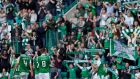  Hibernian players celebrate in front of their fans after the match. Photograph: Russell Cheyne/Inpho