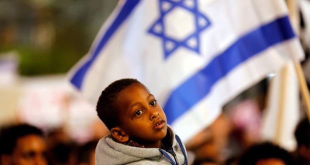  A boy takes part in a protest against the Israeli government’s plan to deport African migrants, in Tel Aviv on March 24th. Photograph:  Corinna Kern/Reuters