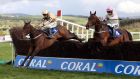 Bellshill ridden by David Mullins (left) jumps the last ahead of Djakadam ridden by Patrick Mullins to win the Coral Punchestown Gold Cup.   Photograph: Niall Carson/PA Wire