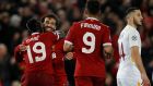Sadio Mané celebrates scoring Liverpool’s third goal against Roma with Mohamed Salah and Roberto Firmino. Photograph: Phil Noble/Reuters