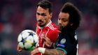 Bayern Munich’s Mats Hummels vies for possession with Real Madrid’s Marcelo during the Champions League semi-final first-leg match at the Allianz Arena. Photograph: Javier Soriano/AFP/Getty Images