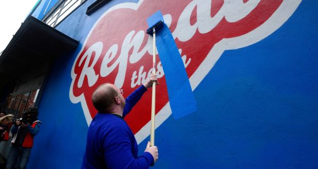 The  Maser artwork outside the Project Art Centre is painted over by artistic director Cian O Brien. Photograph: Cyril Byrne / The Irish Times